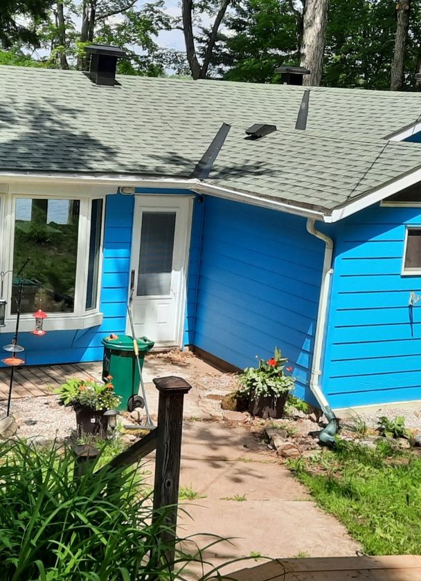 Outside of freshly painted blue house